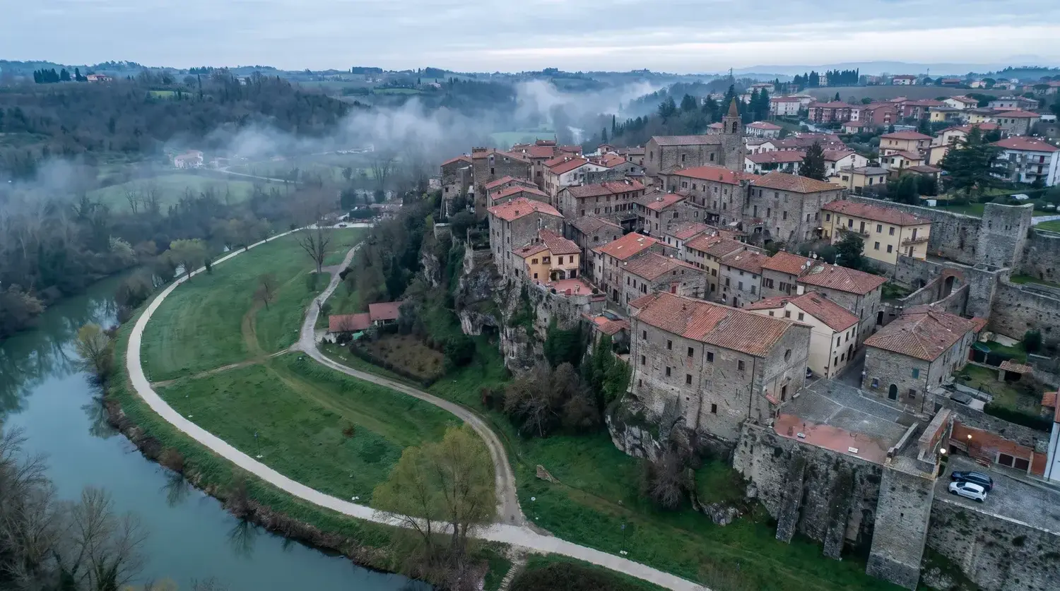 Aerial view of an Italian hill town and the park along the river