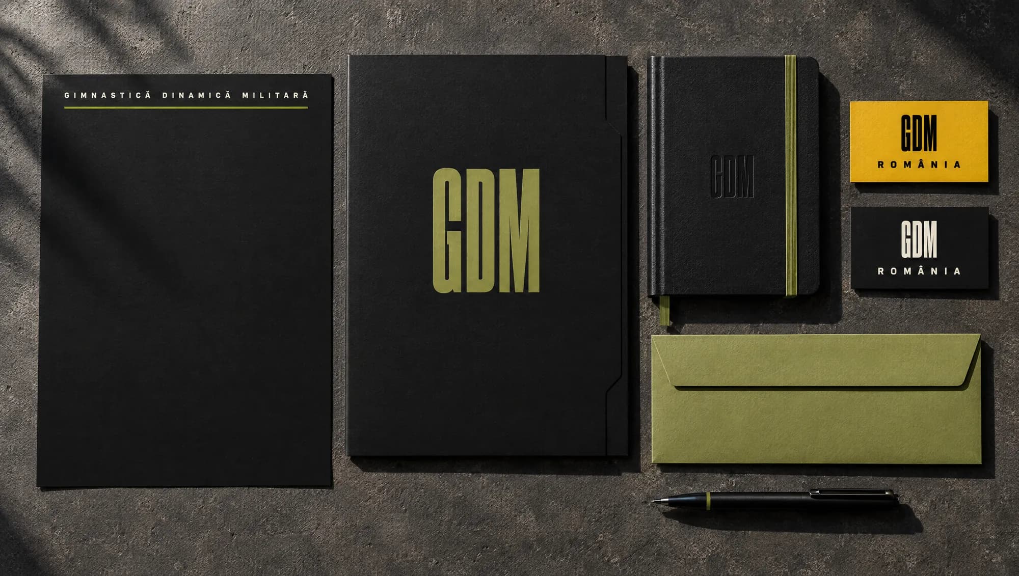 Gimnastică Dinamică Militară letterhead, folder, planner, envelope and business cards on concrete