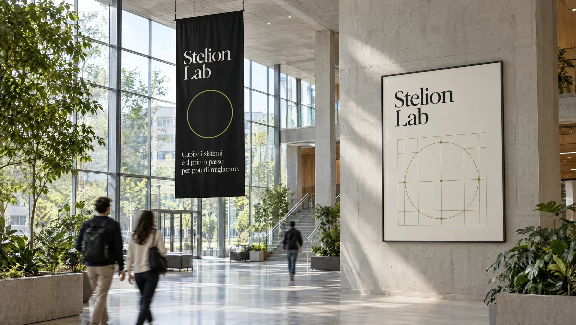 A black Stelion Lab banner and poster in the atrium of a university building
